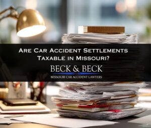 Stack of car accident settlement documents illustrating Missouri car accident settlement tax laws