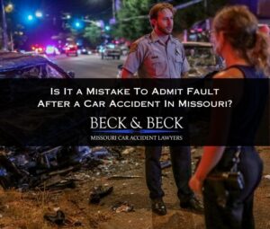 police officers in Missouri speaking with accident victims after a car crash at night