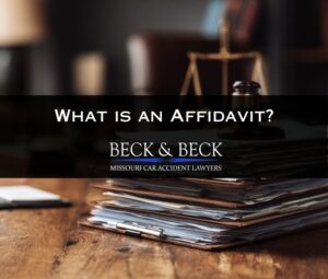 Stack of legal documents relating to an affidavit after a car accident in Missouri
