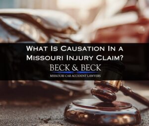 Judge’s gavel in front of damaged vehicles, illustrating causation in a Missouri personal injury claim handled by Beck & Beck Missouri Car Accident Lawyers.