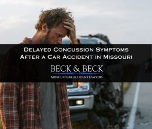 Man standing next to a crashed suv and ford F150 holding his head in pain on a Missouri highway.