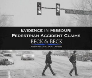 Two pedestrians crossing the street in the winter at a snowy intersection in St Louis Missouri