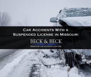 Close up of crashed car in winter on highway in missouri representing a suspended license car accident case handled by Beck & Beck Missouri Car Accident Lawyers