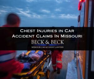 Person on gurney with chest injury, EMTs loading victim into ambulance on a highway in Missouri