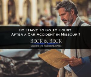 Man with arm in a sling holding legal documents wondering if he will have to go to court after a car accident in Missouri