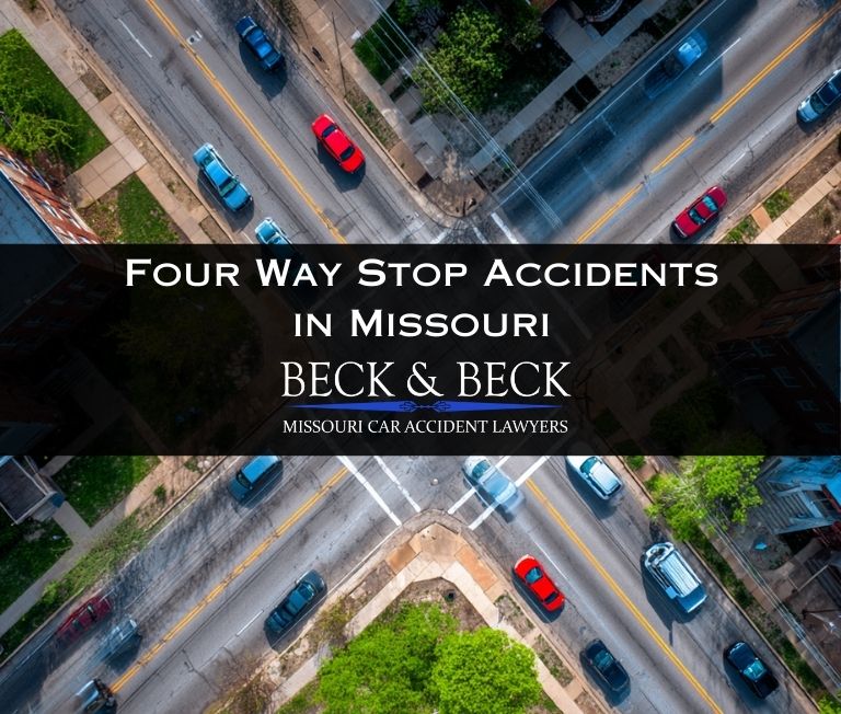 Cars at a four way stop intersection in St Louis Missouri related to a case handled by Beck & Beck Missouri Car Accident Lawyers
