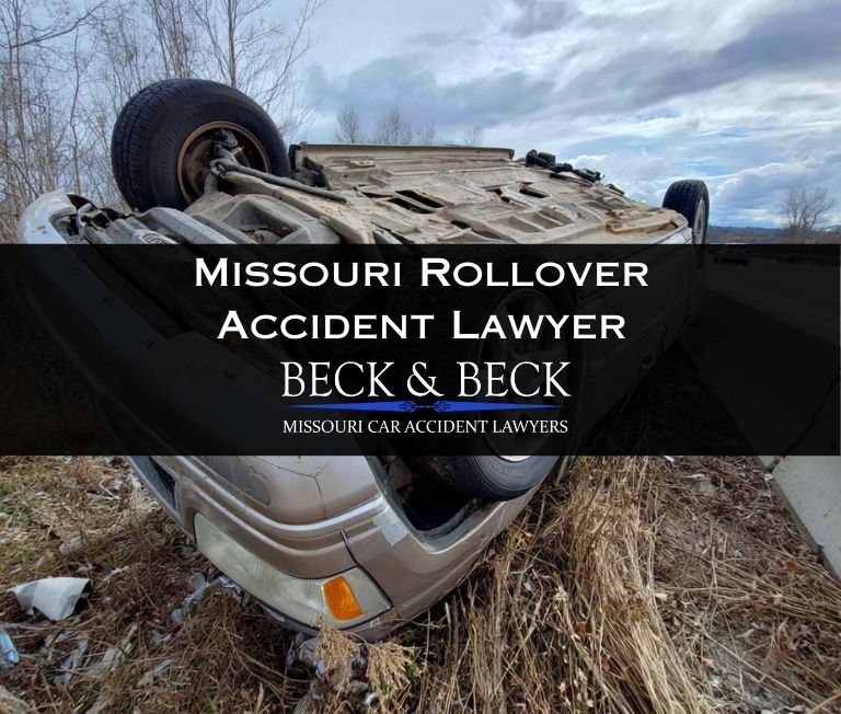 Crashed SUV flipped upside down after hitting a highway median in Missouri illustrating a case handled by Beck & Beck Missouri Car Accident Lawyers