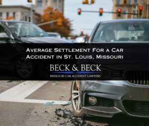 Two crashed cars at an intersection in St. Louis, Missouri illustrating the average settlement for a car accident claim