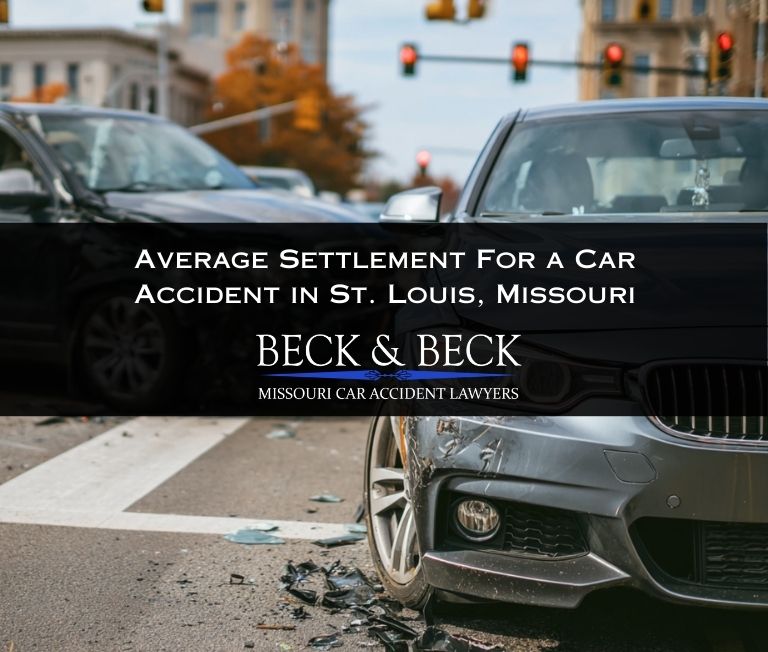 Two crashed cars at an intersection in St. Louis, Missouri illustrating the average settlement for a car accident claim