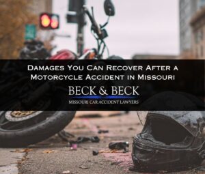 Crashed motorcycle on it's side with a motorcycle helmet next to it in downtown St. Louis, Missouri