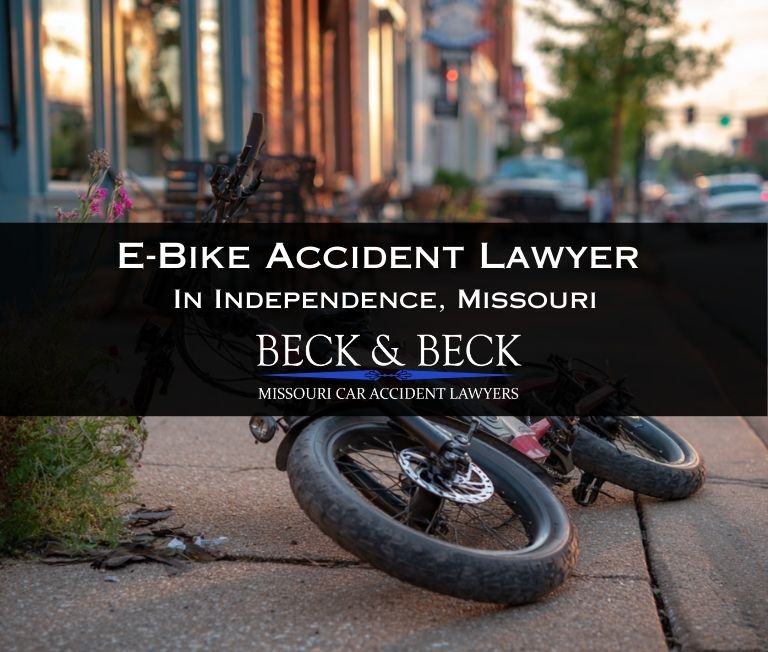 Crashed e-bike on it's side on the sidewalk in downtown Independence, Missouri related to a case handled by Beck & Beck Missouri Car Accident Lawyers