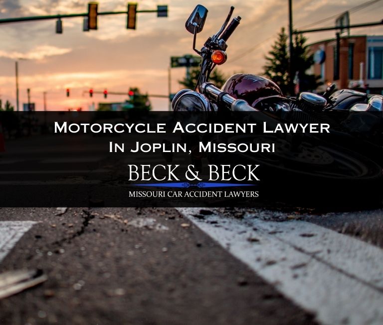 Crashed motorcycle on it's side at in intersection in Joplin, Missouri related to a case handled by Beck & Beck Missouri Car Accident Lawyers