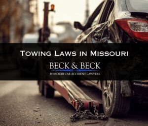 Crashed car being towed from an intersection in St. Louis, Missouri