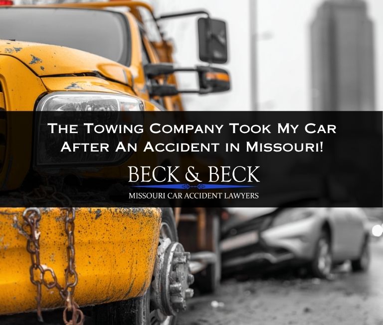 Tow truck towing a car away after an accident in St. Louis, Missouri