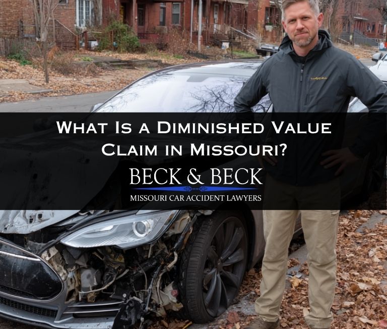 Man standing next to his crashed car in St. Louis, Missouri illustrating what is a diminished value claim