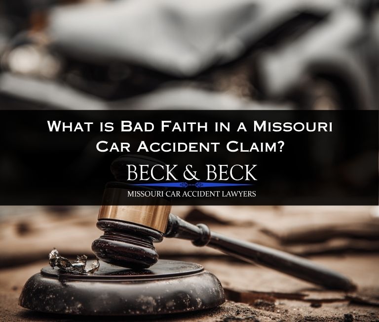 justices legal mallet on a desk with crashed car in the background illustrating bad faith in missouri car accident claims