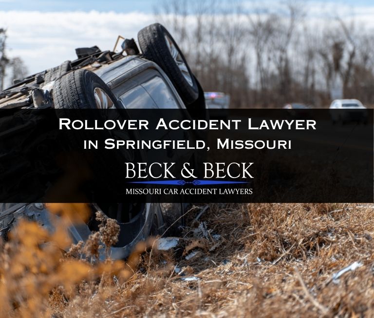 Crashed SUV flipped upside down next to a highway median in Springfield, Missouri