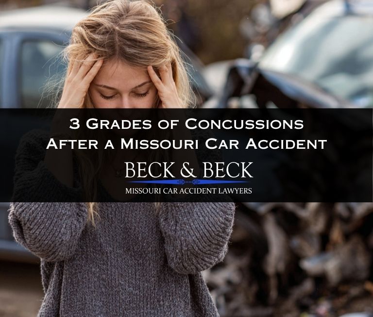 Woman standing next to her crashed car with her hands on her head in pain in Missouri