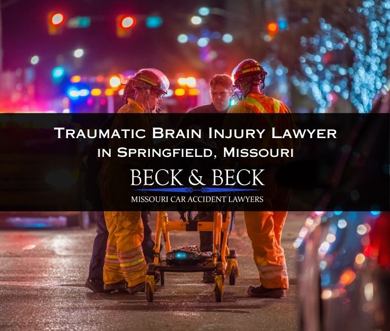 Car crash in Springfield, Missouri with EMTs assisting victim with a traumatic brain injury