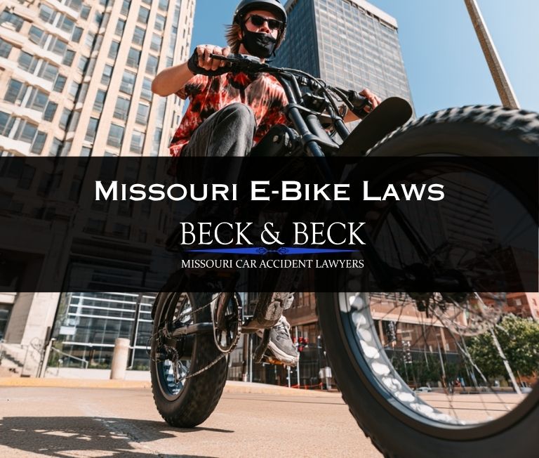 Teenager on an electric bicycle in downtown St. Louis illustrating Missouri e-bike laws