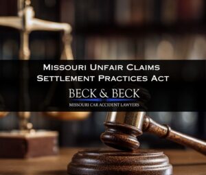 Judges gavel with personal injury scale behind it illustrating Missouri unfair claims settlement practices act