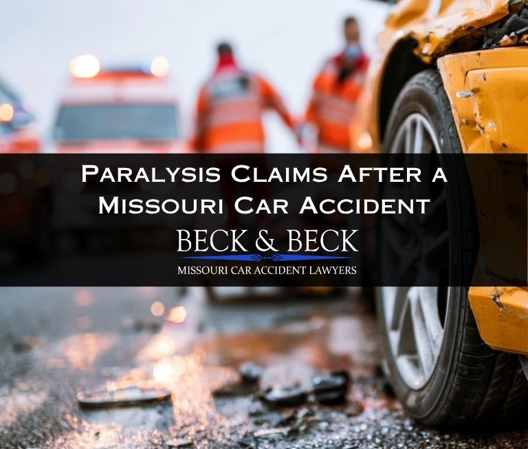 EMTs assisting a car accident victim with spinal cord damage in Missouri