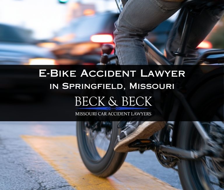 Teenager on an e-bike in heavy traffic in Springfield, Missouri