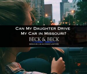 Teenage girl driving her father's car in traffic in downtown St. Louis, Missouri