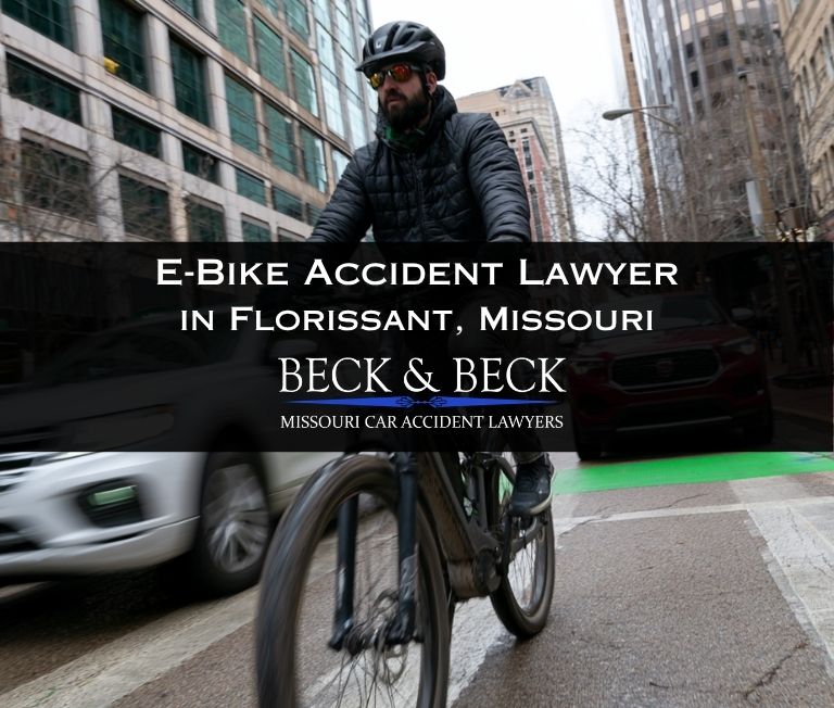 Cyclist on an e-bike in traffic in Florissant, Missouri