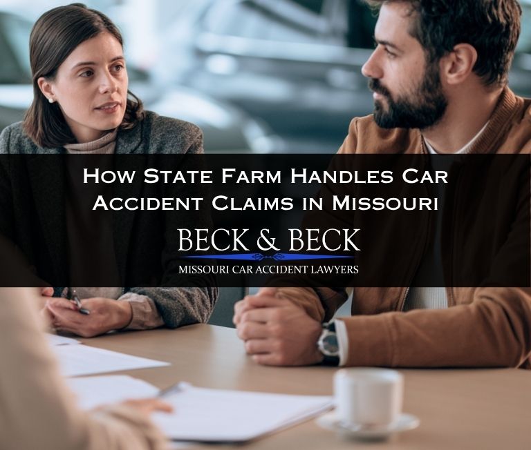 Young couple at a State Farm office speaking with a car insurance adjuster in Missouri