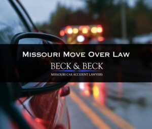 Car pulled over by the side of the road while ambulance passes by in St. Louis, Missouri
