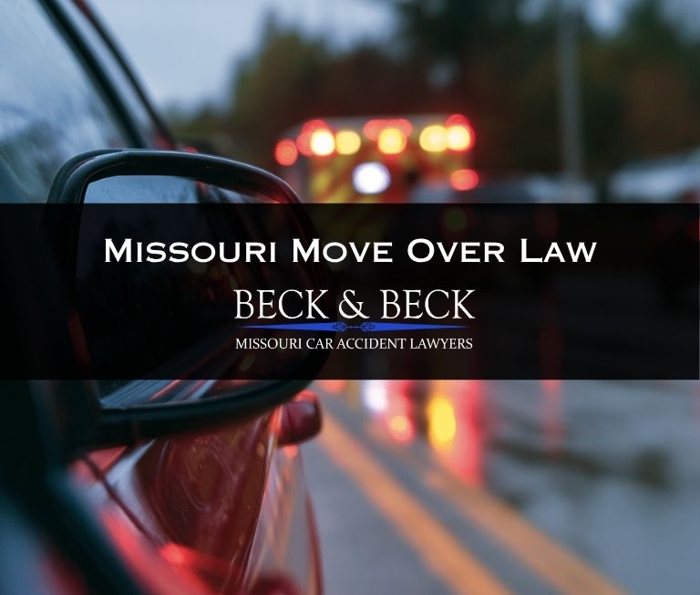 Car pulled over by the side of the road while ambulance passes by in St. Louis, Missouri