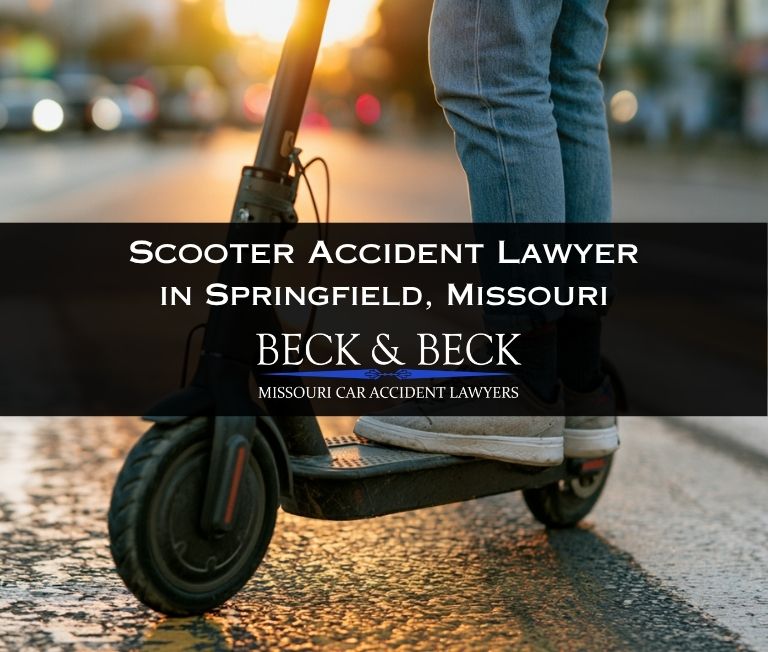 Student on a scooter going to class in downtown Springfield, Missouri
