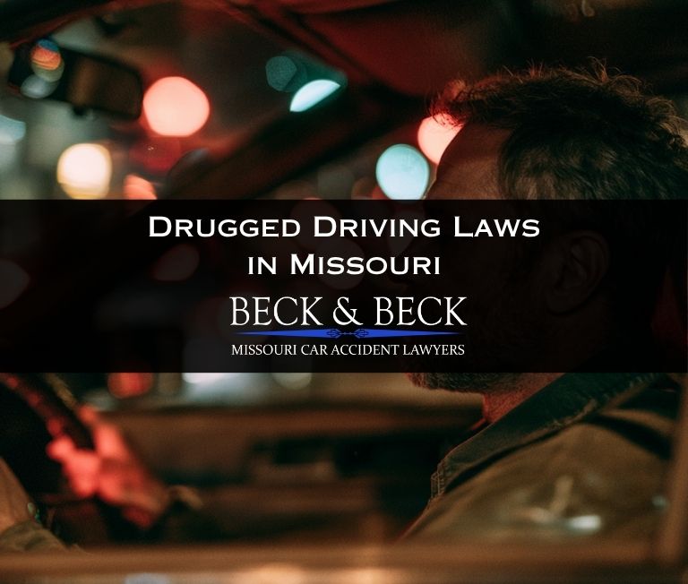 Drugged driver in traffic at night in St. Louis Missouri, traffic lights are blurred