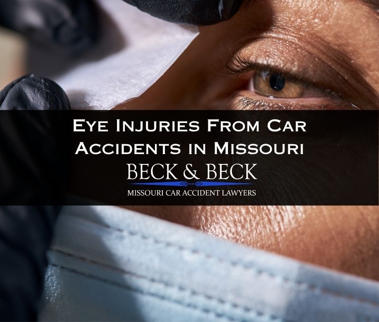 Doctor treating a car accident victim who has an eye patch on in St. Louis, Missouri