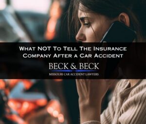 Woman on the phone with car insurance adjuster after an accident in Missouri