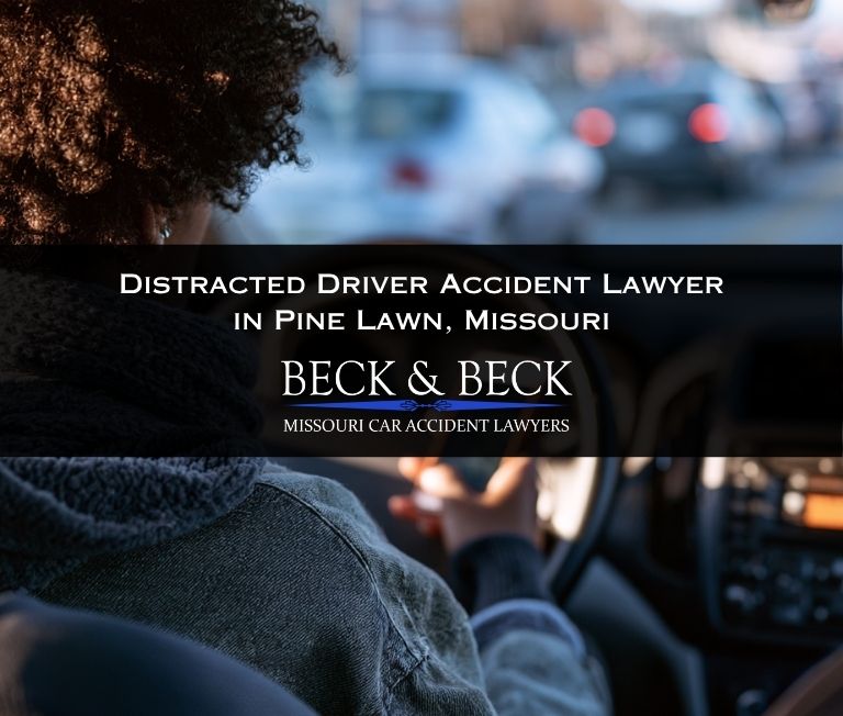 View from behind of a woman texting while driving in Pine Lawn, Missouri