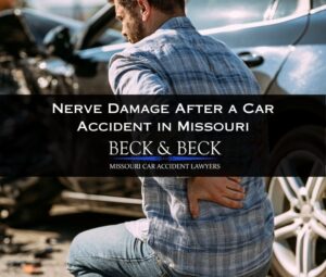 Man with nerve damage next to his crashed car holding his back in pain in St. Louis, Missouri