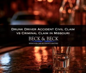 Empty shot glass and car keys illustrating drunk driver accident civil claim vs criminal claim in Missouri
