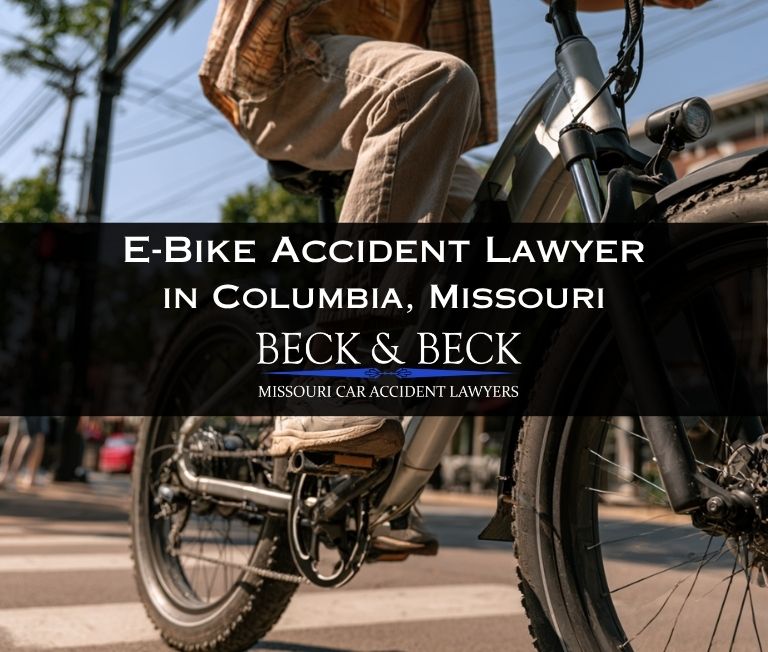 Teenager on an e-bike crossing the street in Columbia, Missouri