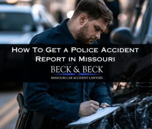 Policeman at a car crash scene making a report in St. Louis, MO