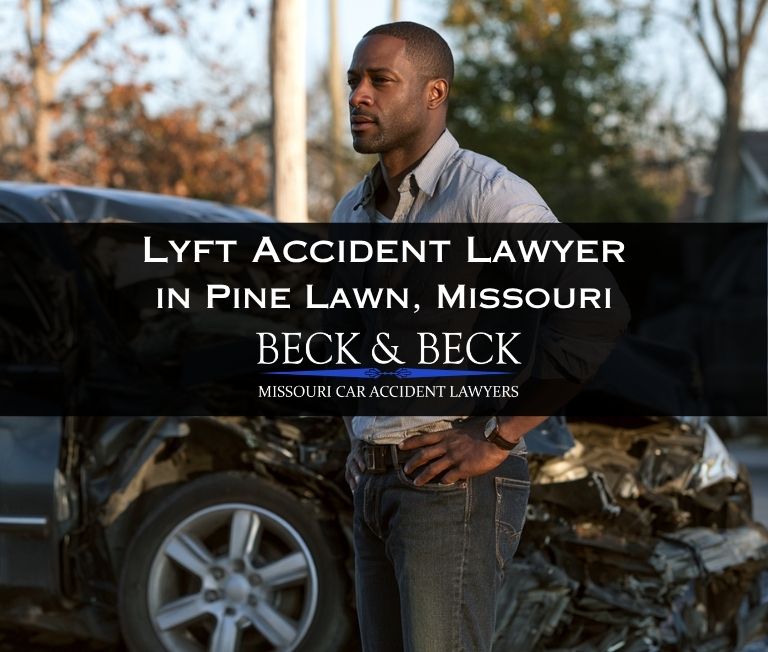 Man standing next to his crashed car after an accident involving a Lyft in Pine Lawn, Missouri