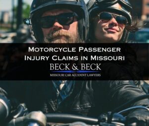Motorcycle rider with a female passenger holding him in traffic in Missouri