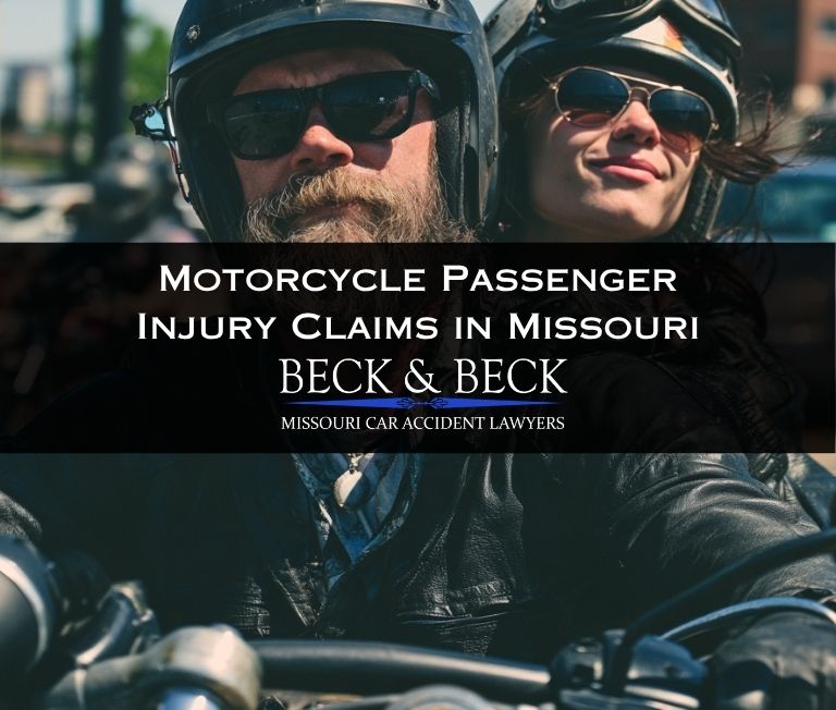 Motorcycle rider with a female passenger holding him in traffic in Missouri