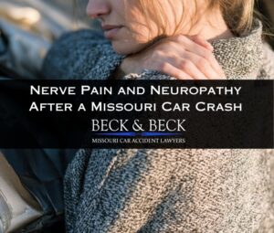 Woman standing next to her crashed car experiencing nerve pain in her shoulder in St. Louis, Missouri